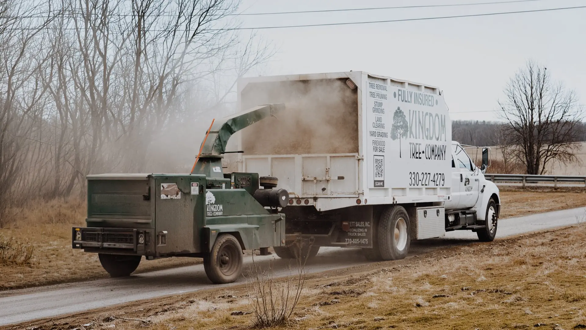 Kingdom Tree Company chipper and dump truck on a job site in Stark County, Ohio
